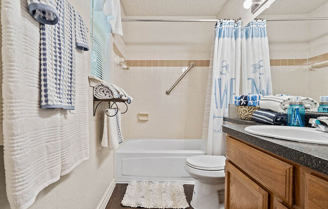 apartment bathroom with a shower tub