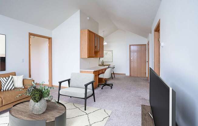 A living room with a couch, chair, and television. Fargo, ND Summit Point Apartments