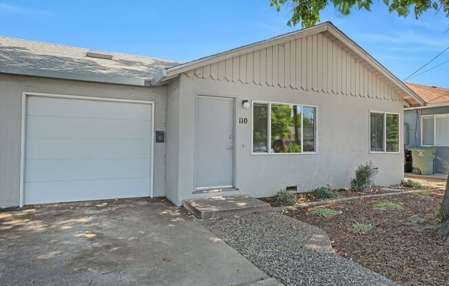 Charming 2 Bed 1 Bath Duplex Unit with Beautifully Landscaped Backyard