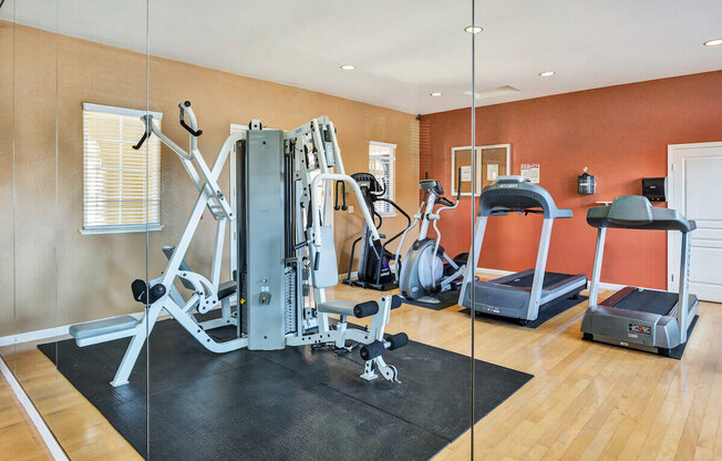 a home gym with a treadmill and weights  at Falcon Bridge at Gale Ranch, San Ramon