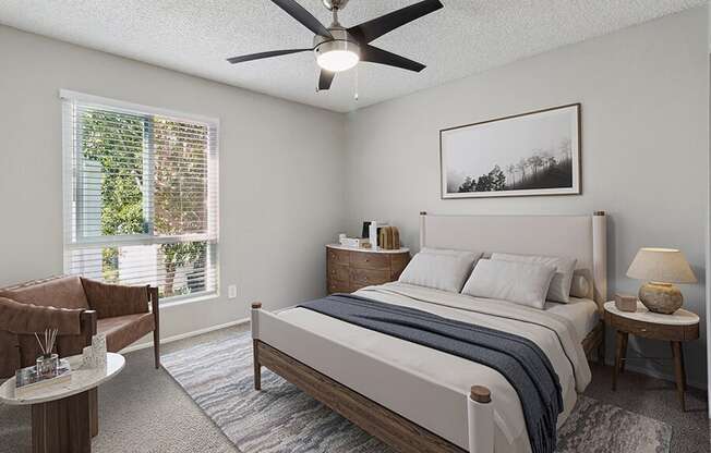 Model Bedroom with Carpet and Window View at Colonnade at Fletcher Hills Apartments in El Cajon, CA.