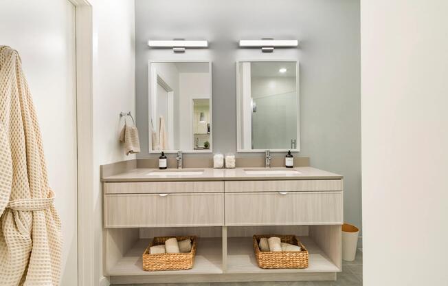 A double vanity with clean finishes, ample storage, and space to get ready with ease.