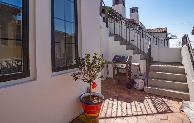 Upscale & Spacious, Spanish Style Tri-Level Townhome w/ Amazing Great Room Living Space, Rooftop Deck, 2 Balconies, Rear Yard & 2-Car Garage Close to Schools, Shopping & Just 2 Blocks to MB Border & 5 Mins to Beach!