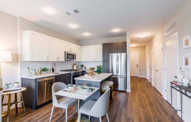 Two-toned cabinetry with upgraded kitchen features including Kitchens including a separate wine fridge and double-door refrigerator*