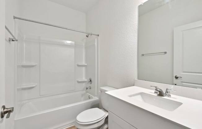 a bathroom with a sink toilet and bathtub