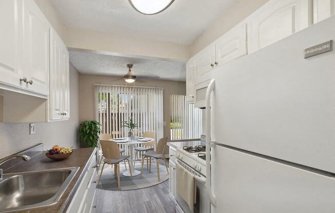 kitchen with dining room table and patio