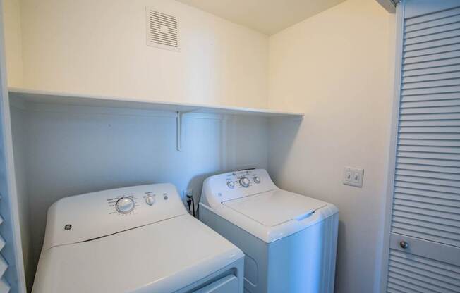 Colton Apartments laundry area with washer and dryer