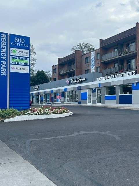 a hospital with an empty street in front of a building