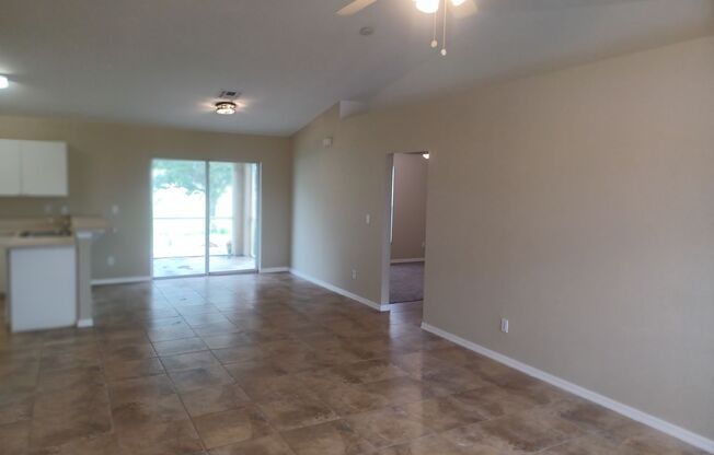 PRICE REDUCTION: Freshly Painted: 3 bedroom 2 bathroom single family home with screened lanai