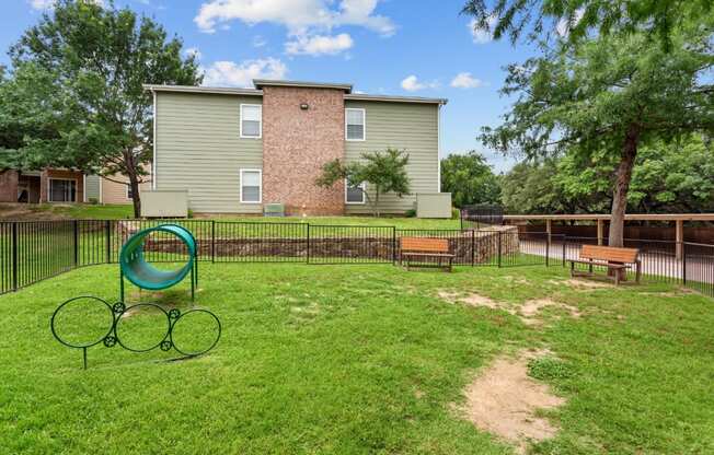 our apartments have a fenced in yard with a playground