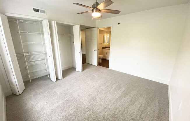 Renovated Master Bedroom with Ceiling Fan at Green Ridge Apartments in Grand Rapids, MI
