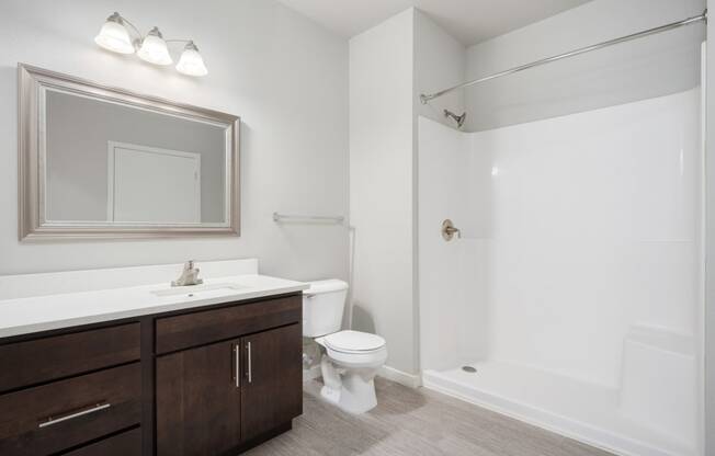 an empty bathroom with a toilet sink and shower