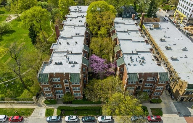 an aerial view of a building next to a parking lot at The Bryant at Oak Park I & II, Oak Park, IL