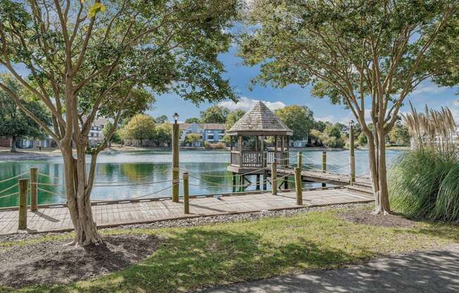 a dock with a gazebo on the water