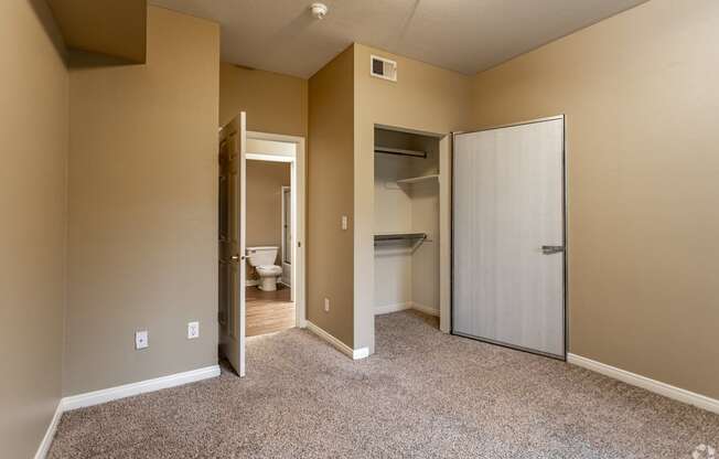 The master bedroom features a fully renovated en-suite bathroom and plush carpeting, creating a fresh and comfortable retreat.