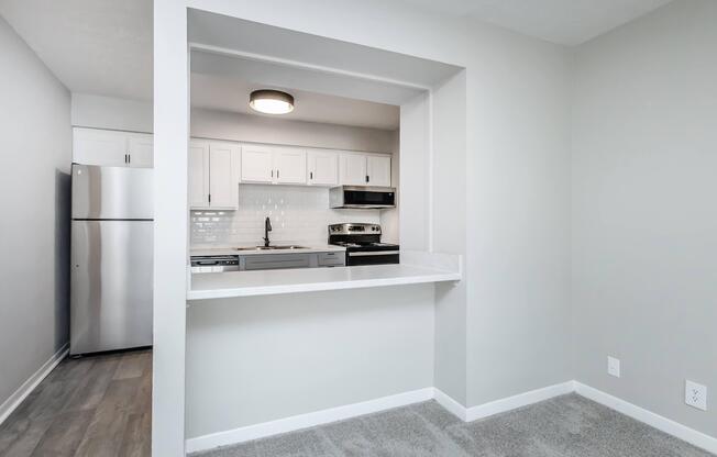 a kitchen with a sink and a mirror