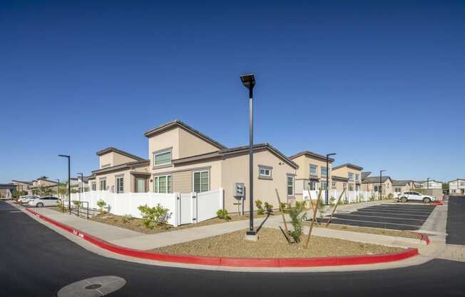 a row of houses with a street in front of them at Grandstone at Sunrise, Peoria, AZ