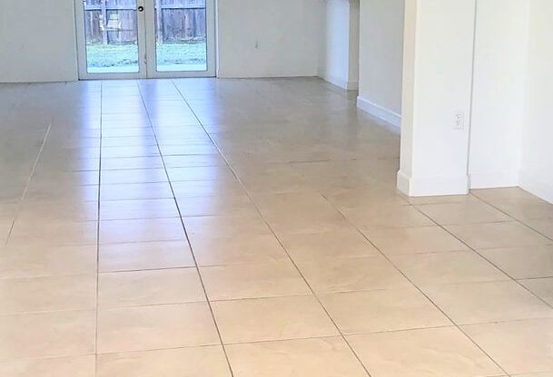 Single-story, 3/2.5 corner lot located near multiple FL Turnpike exits