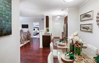 Dining room next to entryway and front door; open to kitchen