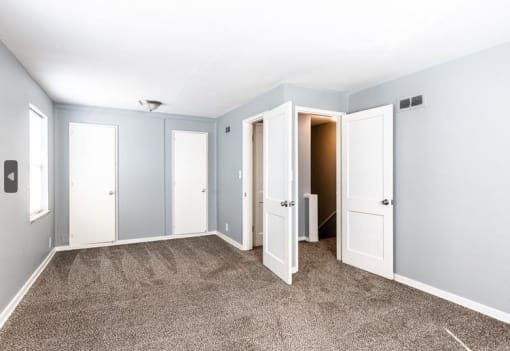 a bedroom with two closets