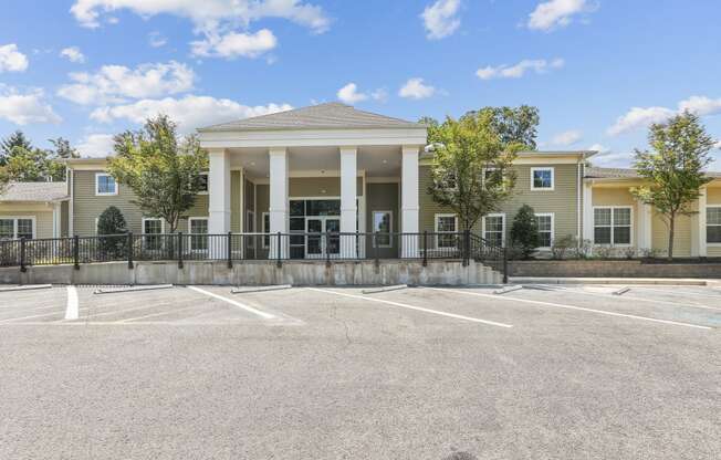 a large building with an empty parking lot in front of it