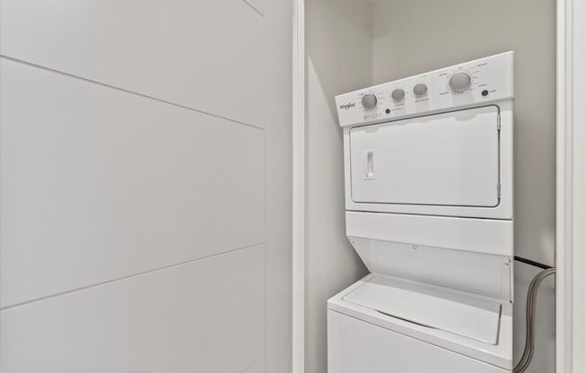 A white dishwasher is installed in a kitchen.