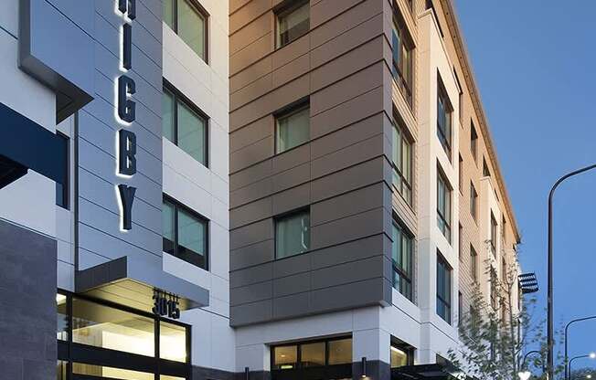 The image shows a modern building with the name