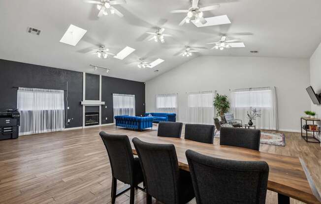 A conference room with a long table and chairs.