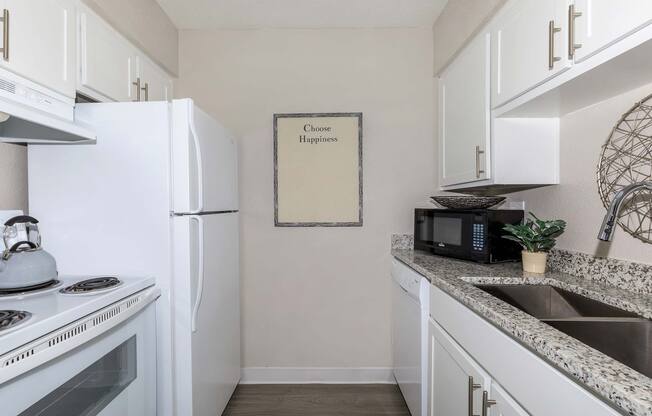 a stove top oven sitting inside of a kitchen