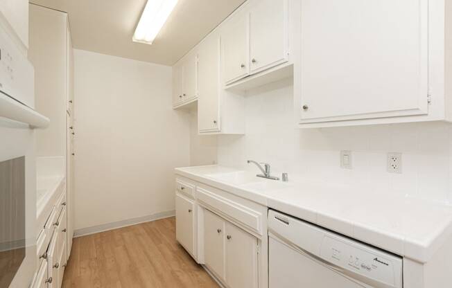 Kitchen with White Appliances and White Cabinets