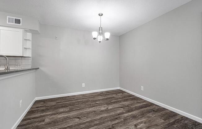 BREAKFAST BAR TRANSITIONS INTO DINING AREA