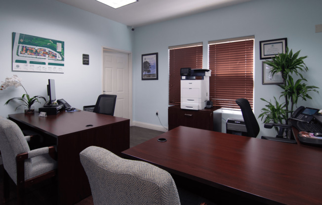A room with a desk and chairs.,A room with a desk and chairs.