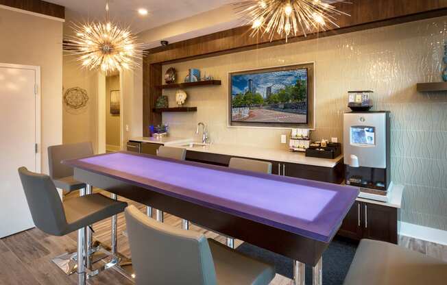 a dining room with a purple table and chairs