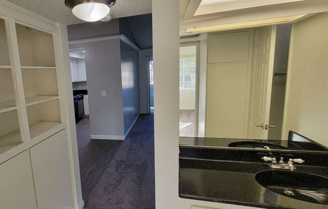 Open vanity off bedroom hallway at Northwood Apartments in Upland, California.
