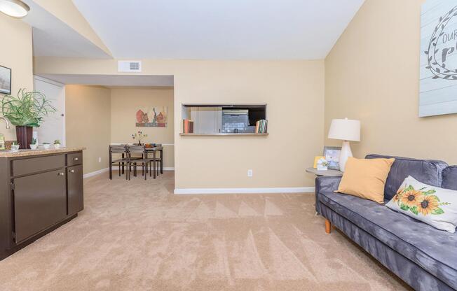 a living room filled with furniture and a flat screen tv