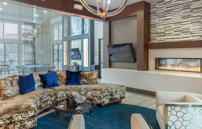 a living room filled with furniture and a large window