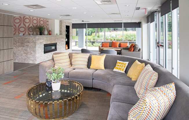 Community lounge area with fireplace at The Pavilion, Michigan, 48207