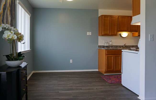 Open Dining Room with hardwood floors and easy access to Kitchen, at Gale Gardens Apartments