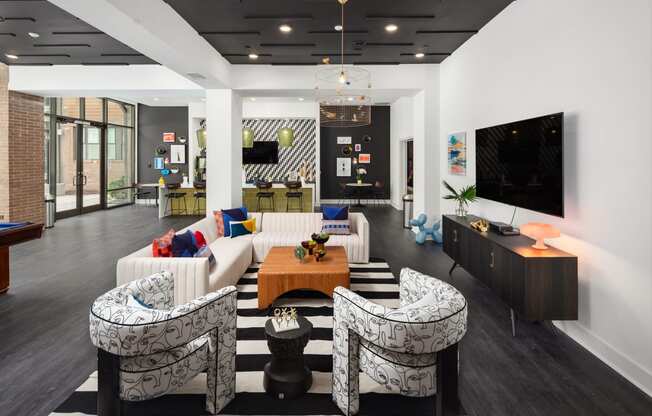 a living room with couches and a table and a television