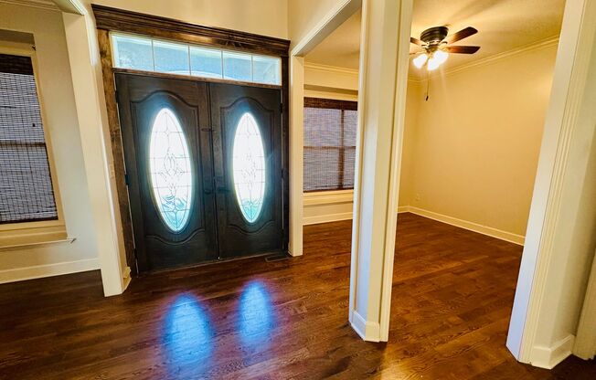 {20067} Custom Built Home in Woodland Manor + Open Main Level with Modern Lighting and Hardwood Flooring + Finished Walk Out Basement + Enclosed Sunroom + Three Car Garage + Fenced Yard