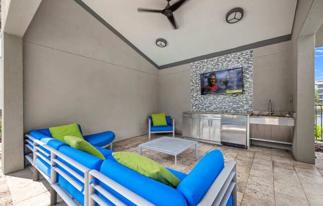 a living room with couches and a table and a tv