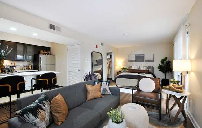 a living room with a couch and a bed