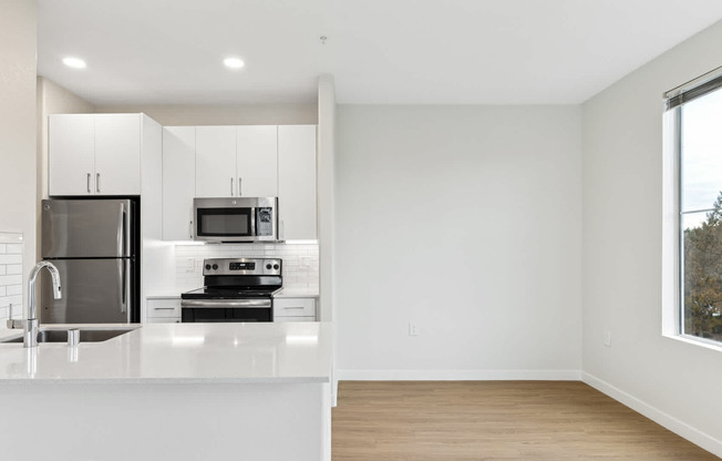 Kitchen with island and hard surface flooring