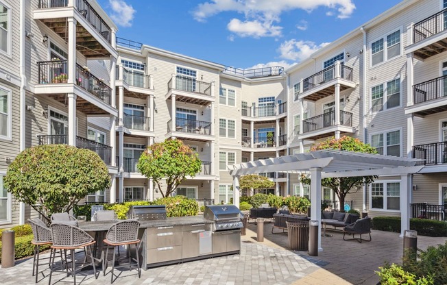 A sunny day at the outdoor patio of a modern apartment complex.