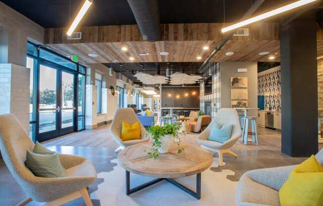 a room with chairs and a table with a vase of flowers on top of it at 511 Meeting, Charleston, South Carolina