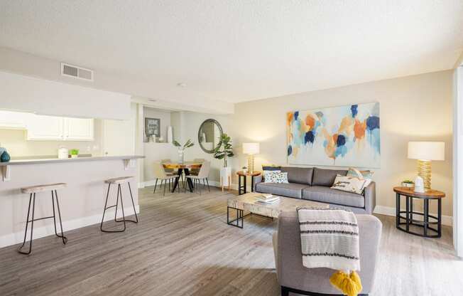 a living room with a gray couch and a gray coffee table