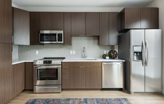 Cabinet pace and stainless steel appliances at PARK40, Broomfield, Colorado
