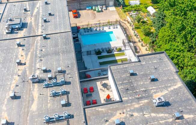 arial view of a building with a swimming pool