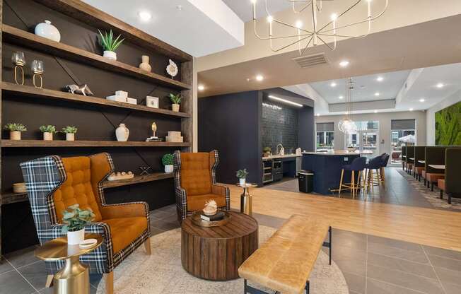A modern living room with a wooden floor and a variety of seating options.