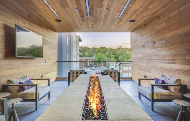 a living room filled with furniture and a fireplace